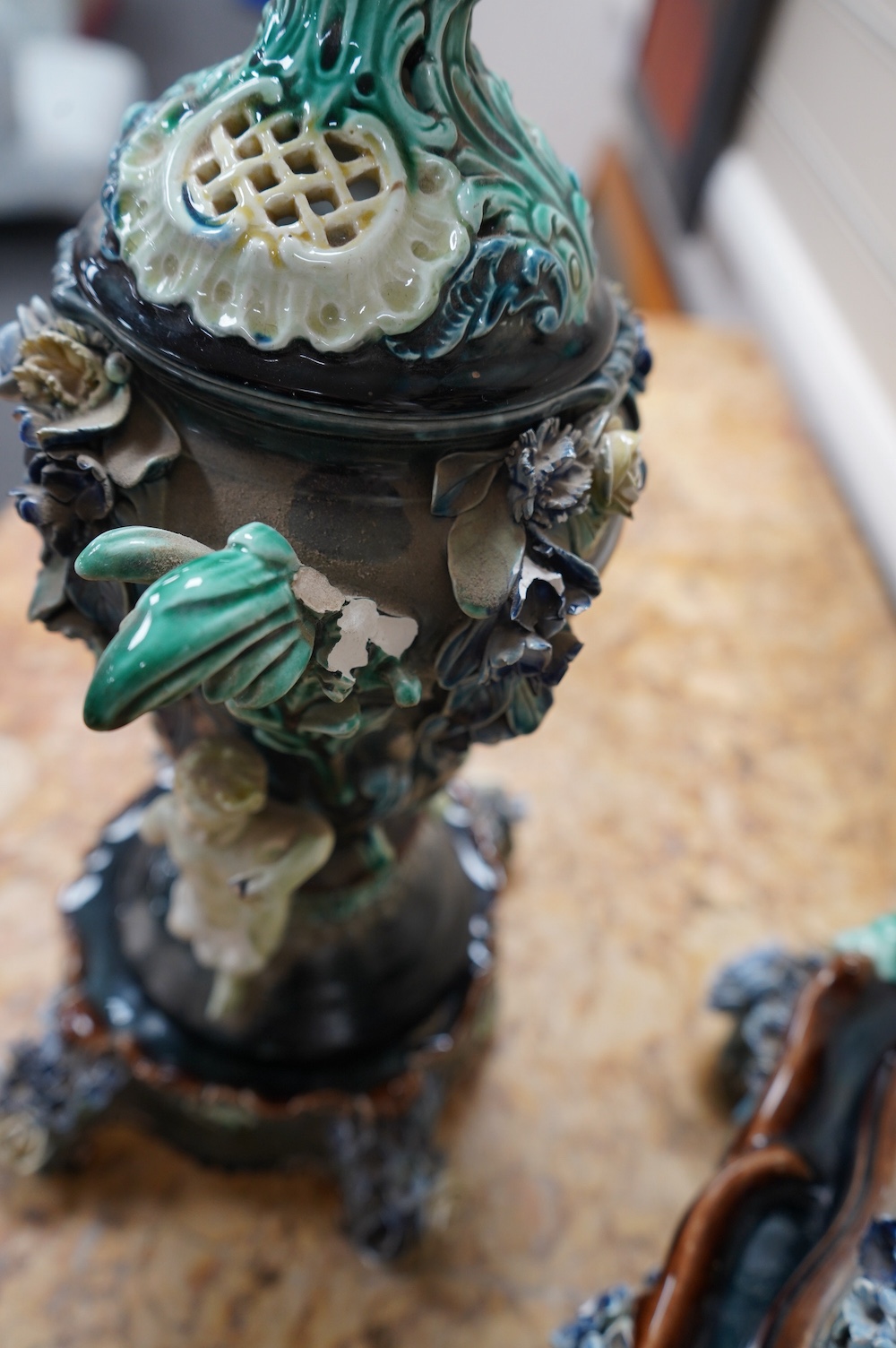 A Rorstrand pottery figural clock garniture with enamel dial and floral encrusted decoration, largest 57cm high. Condition - poor